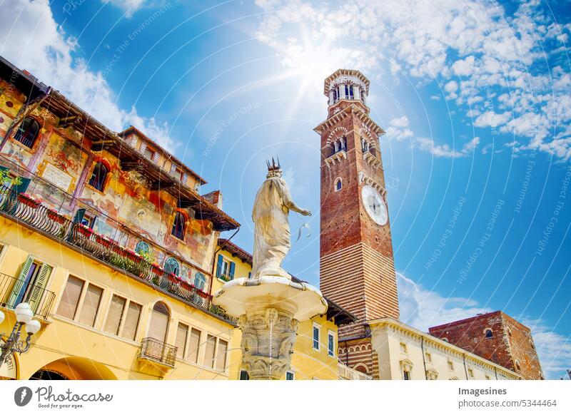 Madonna fountain statue and bell tower Torre dei Lamberti in Piazza delle Erbe. Verona, Italy Statue Blue Sky Sun Sunbeam famous Bell tower piazza dent Legacy