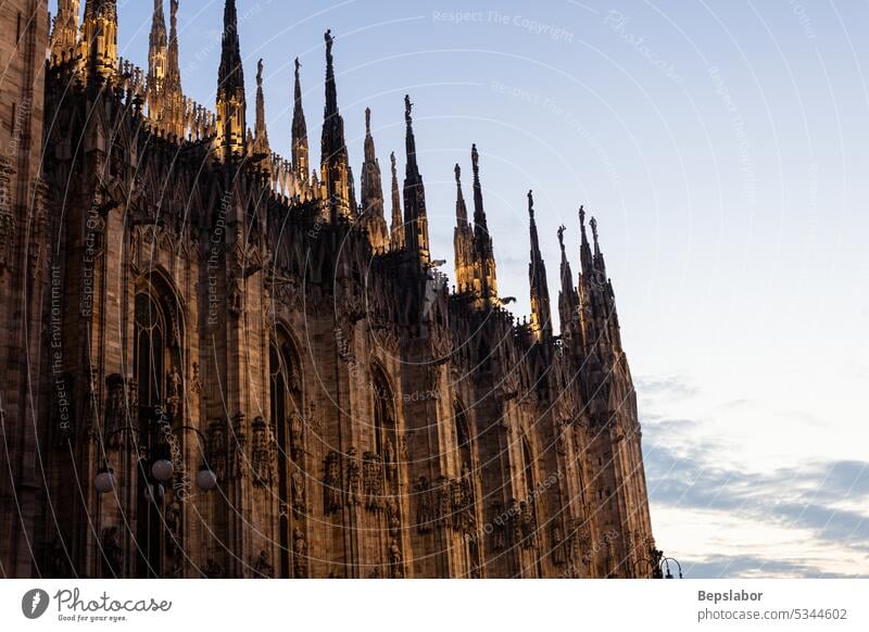 Beautiful Milan cathedral close up view. Duomo di Milano closeup milan italy sculpture duomo marble religion gothic illuminated sunset history statue historical