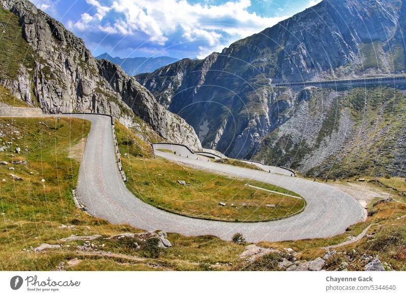 Pass road in the Alps alpine panorama pass road Switzerland Nature mountain Wall of rock Street mountains Clouds