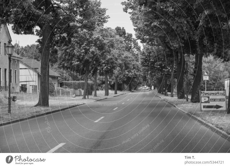 Village street / parking lot right b/w Brandenburg Spring Street Avenue Black & white photo Exterior shot Deserted Day B/W B&W Calm Loneliness