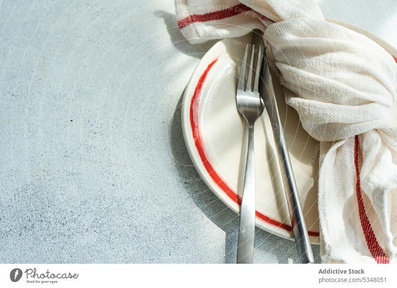 Minimalistic table setting with tableware background concrete cutlery dark diet dinner eat eating fasting food meal minimal minimalism minimalistic napkin place