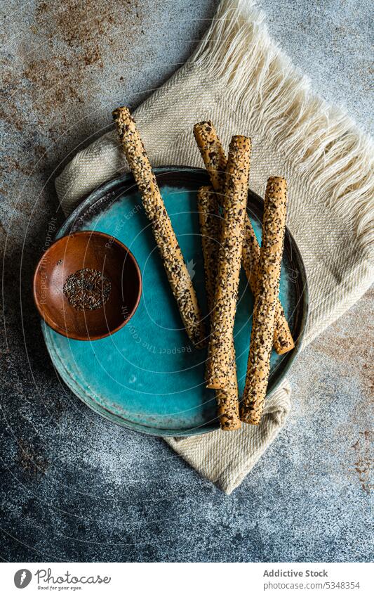 Bread sticks with seeds background baked bowl bread ceramic chia cooked crusty diet eat eating flax food gourmet healthy meal mix plate sour dough table tasty