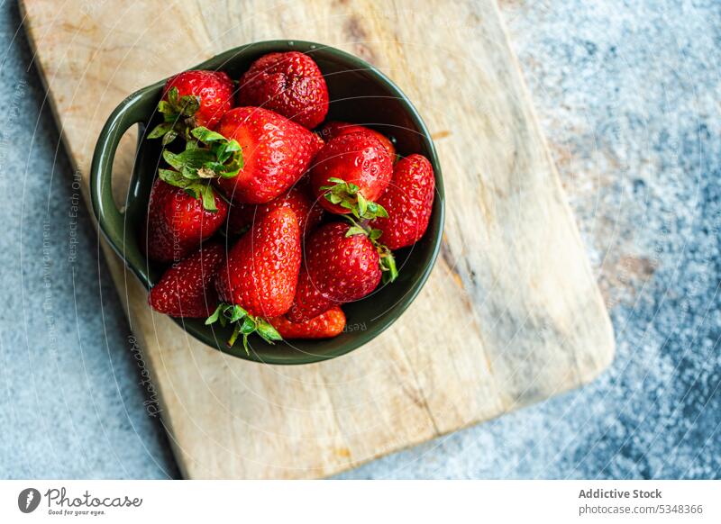 Fresh strawberry fruits in the bowl ceramic close up dessert detox diet eat eating food gourmet healthy cutting board meal organic red ripe seasonal sweet table