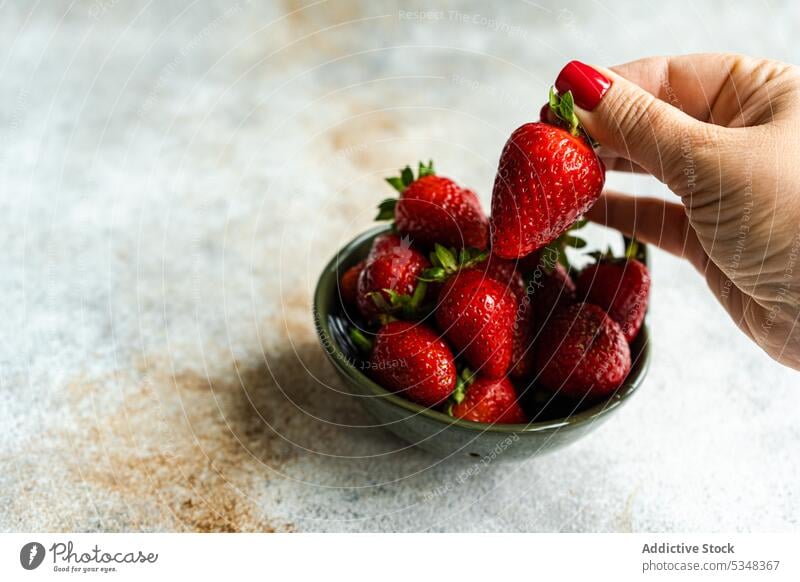 Fresh strawberry fruits in the bowl woman hold ceramic close up dessert detox diet eat eating food gourmet healthy meal organic red ripe seasonal sweet table