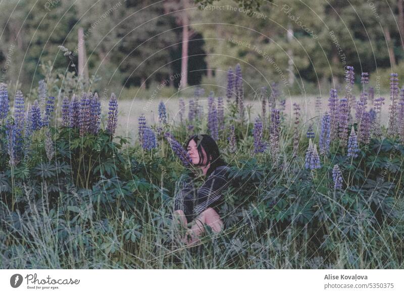 in a field of lupines portraits self portraits Lupin flower field of flowers trees meadow Girl dark hair