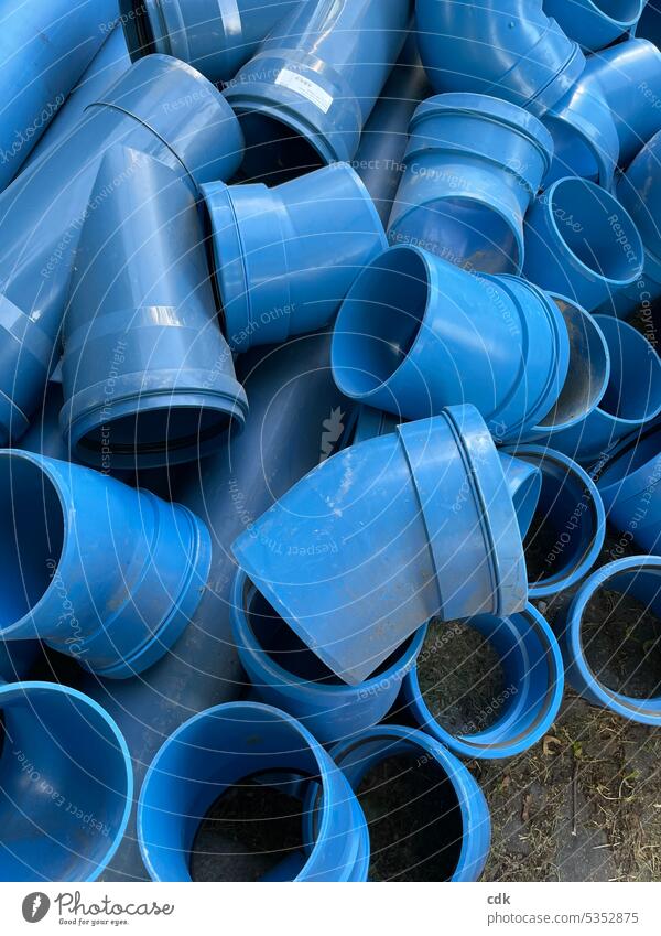 A pile of blue pipe pieces | plastic pipes | road construction conduit reeds Industrial Industry Construction Transmission lines Pipe Conduit Technology