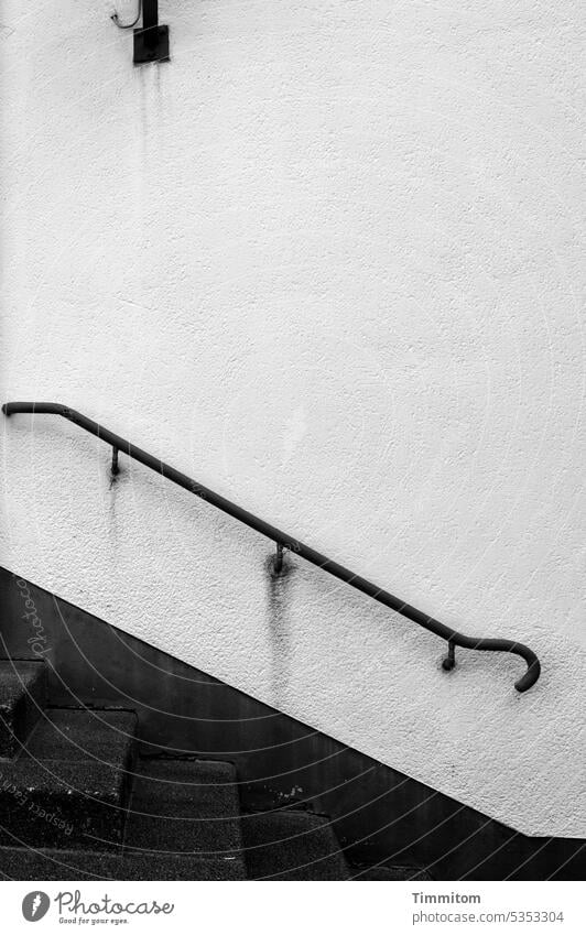 Outdated handrail Metal Old Building Wall (building) Stairs stair treads Help Structures and shapes Gray Upward Downward Deserted Black Tracks Lamp power supply