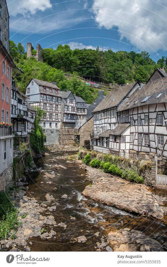 Half-timbered idyll on the Rur Monschau Eifel River Rur Half-timbered house Sky blue historic old town Picturesque Half-timbered houses Bridges reflection