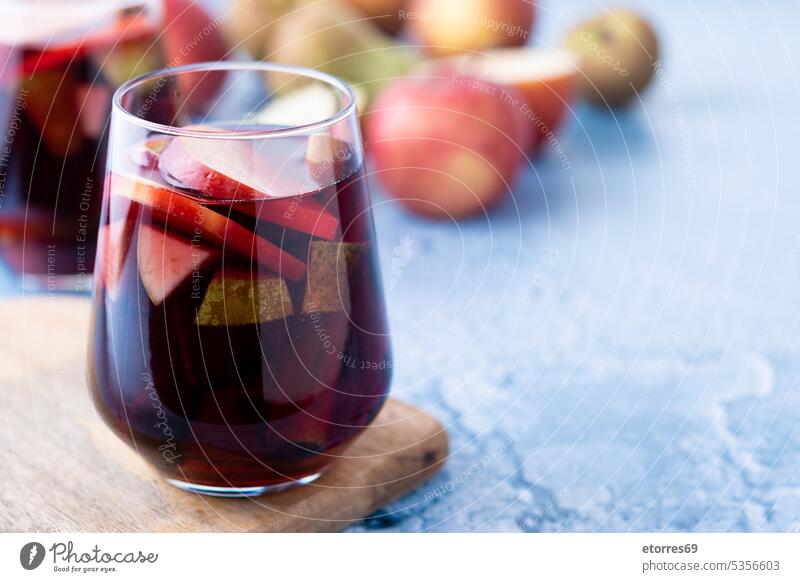 Autumn sangria with pear and apple on blue background alcohol autumn beverage cider cinnamon cocktail cold delicious drink fresh fruit glass homemade isolated