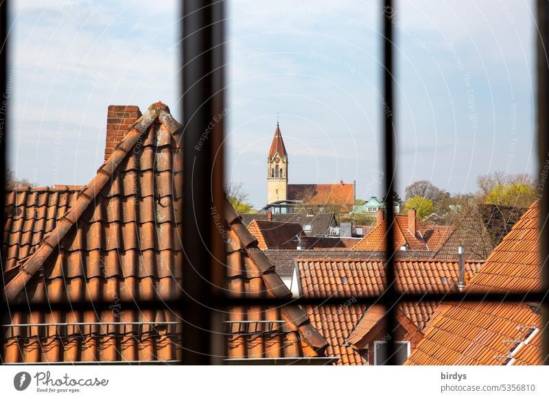 View through a mullion window on the mountain church Osnabrück Church roofs Old town rooftop landscape View from a window Christianity Protestant