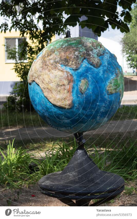 photo globe with continents made of stone the globe in the street art ocean map planet abstract concept global sphere highway image trip around worldwide