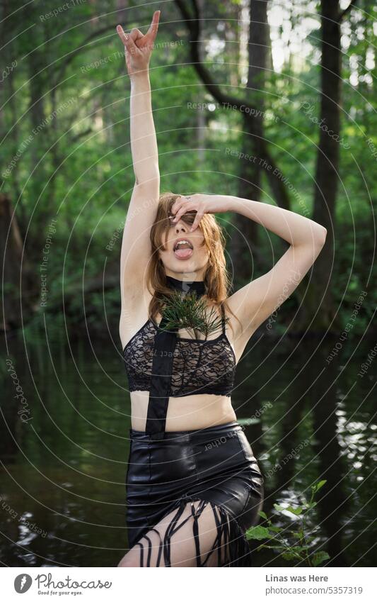 It’s time to party in the swamp. A gorgeous brunette girl in a see-through bralette is ready to do so. Her sexy curves, hot temperament, and wild surroundings are in this image.