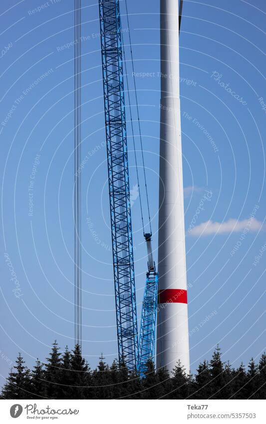 a modern wind turbine construction site from above perpendicular crane wind turbine assembly wind park wind energy green nature spring trees clean energy