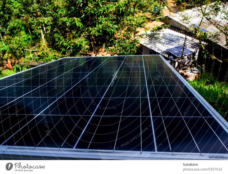 Solar Panel on Roof of fruit farmer's house in the forest solar panel roof old nature home small countryside tile environment sun power energy sunlight blue sky