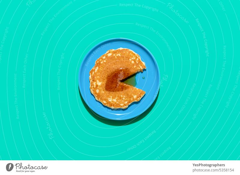 Pancake with mapple syrup on a blue table, above view. american background baked breakfast bright brunch color concept copy space cuisine cut out delicious