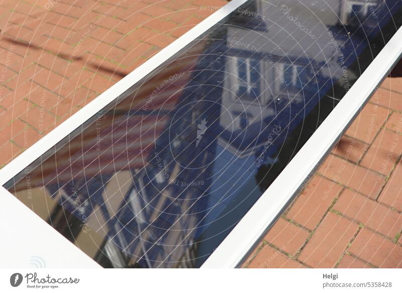 Solar bench in the pedestrian zone with reflection of historical houses Bench Modern Innovative Electricity Power generation Current Deserted Break Relaxation