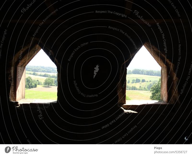 View from Waldnerturm (Four Knights Tower) near Hemsbach through window openings towards Odenwald forest Perspective Destination History of the