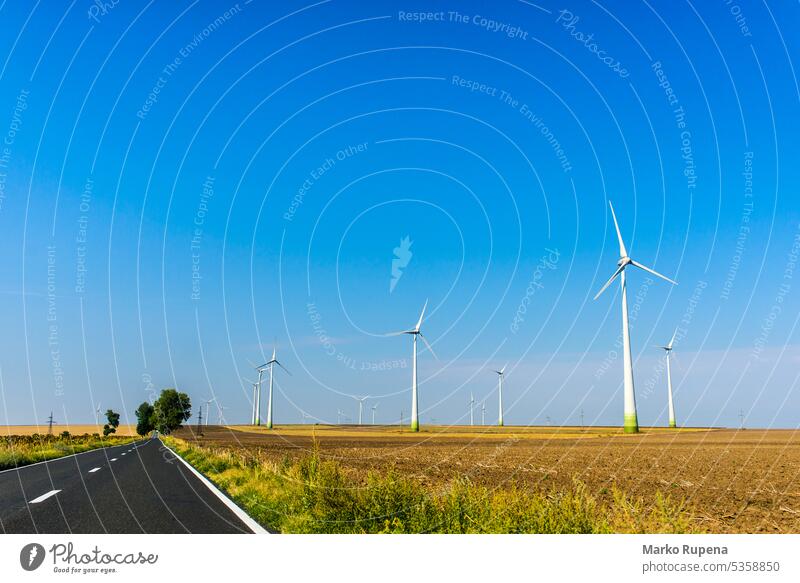 Windmills transforming wind power in electricity windmill turbine energy technology environment landscape industrial generator "sustainable resource" rotation