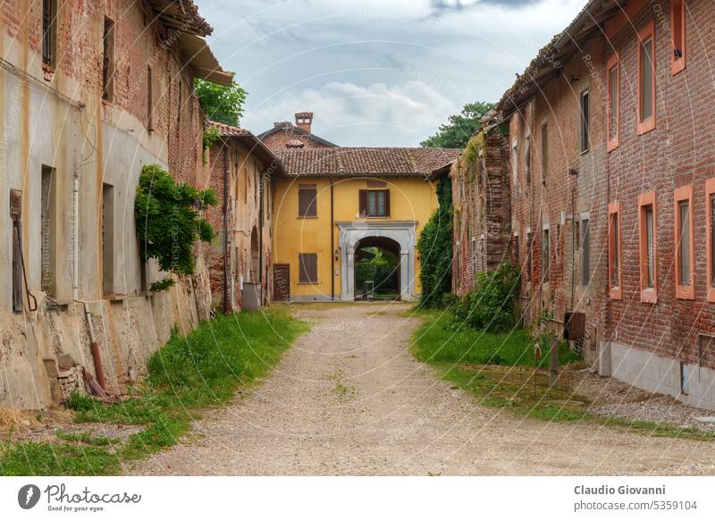 Carpignago, historic rural village in Pavia province, Italy Europe Lombardy architecture building color country day exterior farm flower gate house old outdoor