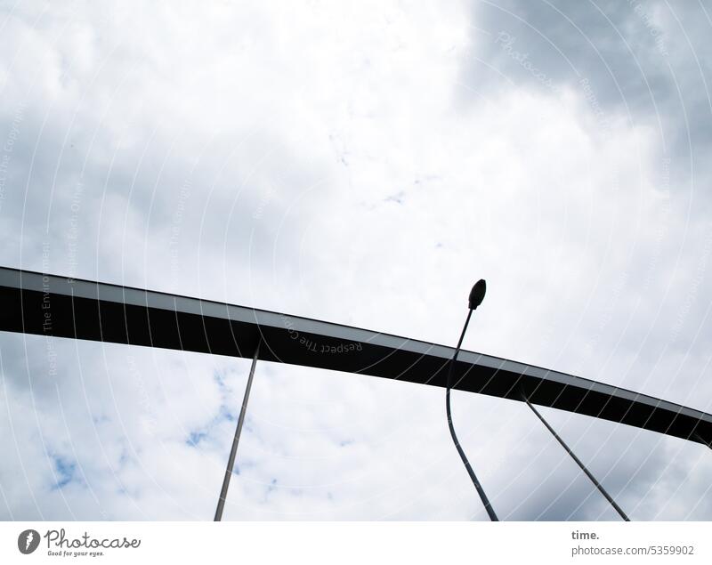 gray in gray | bridge support with lamp Bridge Sky Weather Clouds Iron Architecture Manmade structures Construction Steel construction windy Lamp streetlamp