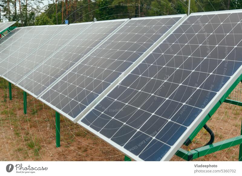 Photovoltaic Solar Panels, Power Station. Sustainable Technology. Alternative source of electricity solar station sustainable photovoltaic panel power blue wire