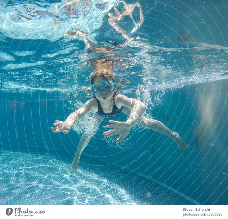 Child jumps into the water, dives and continues swimming under water be afloat cooling Summer Water Swimming & Bathing Refreshment Wet bathe Joy