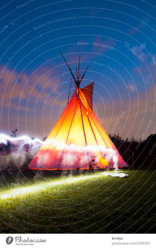 North American teepee at night. Long exposure, motion blur. Tee Pee Nature Night sky Stars Summer Meadow Illuminate Starry sky Smoke Fireglow Esthetic Fantastic