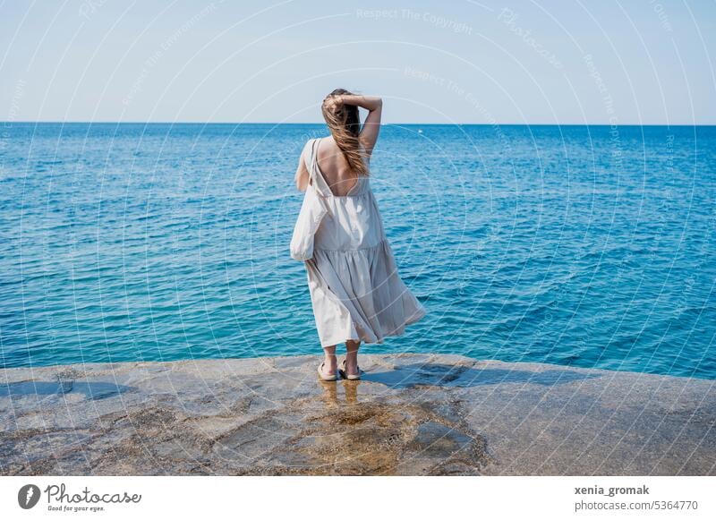 Young woman at the sea vacation Vacation & Travel Ocean Relaxation Summer Beach Tourism coast Water Vacation mood Walk on the beach Vacation photo
