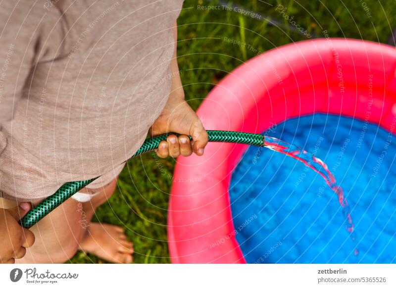Fill paddling pool Refreshment Relaxation holidays Garden stop ardor heat wave midsummer Child Toddler Paddling pool Hose Summer vacation Water at home