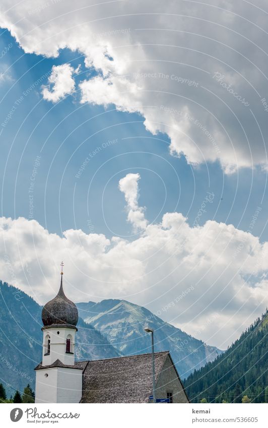 Church in the village Landscape Sky Clouds Sunlight Summer Beautiful weather Forest Hill Rock Mountain Building Church spire Blue White Idyll Colour photo