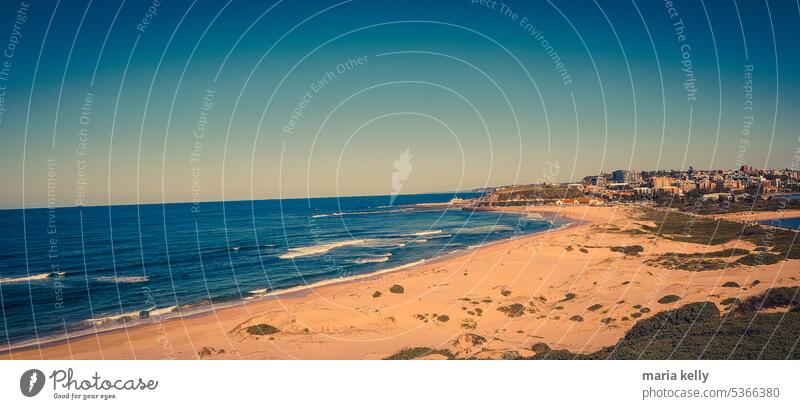 coastal city with view of beach Sand Waves Surfing Ocean Architecture City Blue White Sandy beach outdoors holiday vacation travel horizon Sky