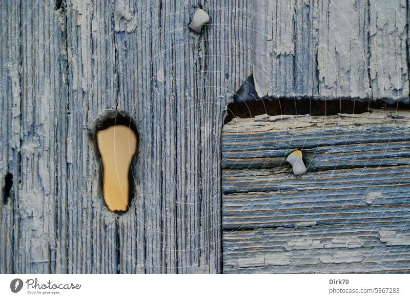 View through keyhole on old wooden door Wood Wooden door Blue Keyhole Old Entrance Closed Front door Deserted Structures and shapes Colour photo Detail
