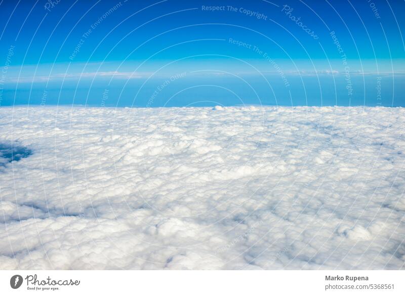 View over clouds from an airplane above clouds atmosphere background beautiful beauty blue bright clear cloudscape cloudy flight fly freedom heaven high horizon