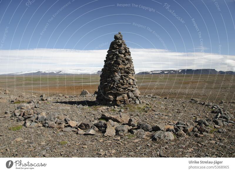 Iceland | Landmark and stone circle in the highlands landmark Stone circle stones Gravel Pile of stones mountains Snow Snowcapped peak Clouds Sky Blue Brown