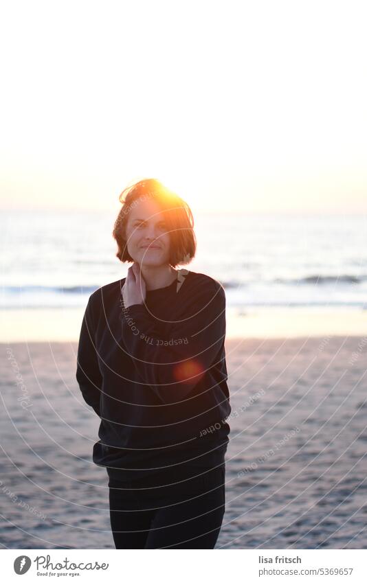 SUNSET - THOUGHTFUL Woman 30-35 years Brunette Short-haired standing by the sea Ocean Sand Beach North Sea Sylt Vacation & Travel Beautiful weather