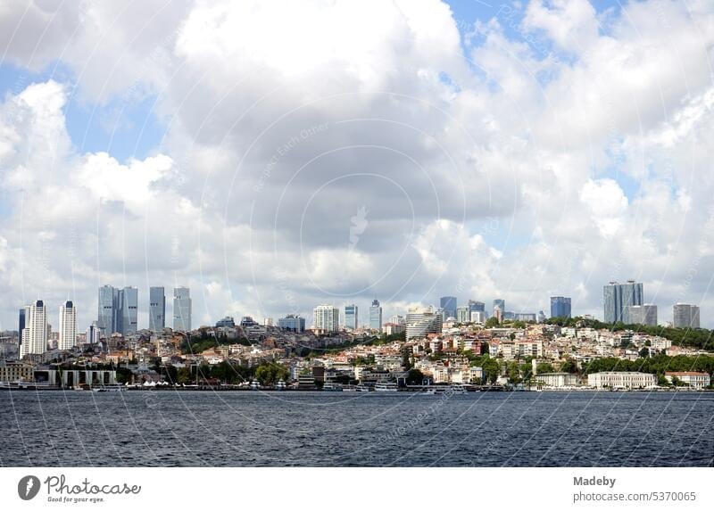 View from the ferry to Üsküdar to Dolmabahce Palace in Besiktas district in summer with clouds and sunshine in Istanbul on the Bosporus in Turkey The Bosphorus