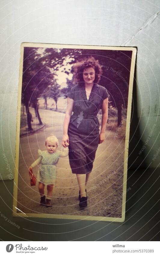 Analog color photo from 1958, mother with toddler walking on an avenue old photo Memory Colour photo Mother Child Nostalgia Former Past Infancy