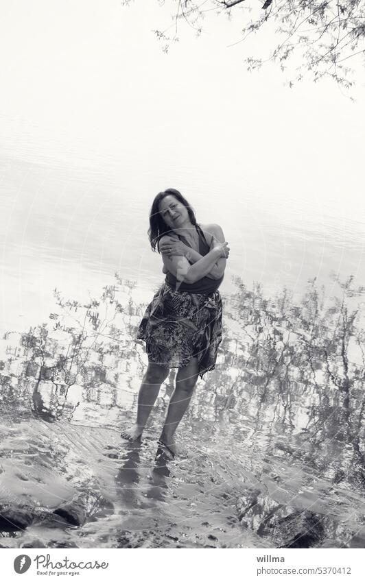 Feel good in nature Woman Water River bank Lake To enjoy Barefoot reflection Summery tread water Shallow B/W Relaxation feeling of happiness Summer delights