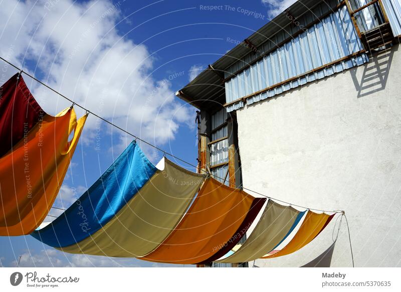 Stretched colorful cloths as a sun sail on the roof terrace of a hotel in the Taksim district in the summer sunshine at the Istiklal Caddesi in Istanbul on the Bosporus in Turkey