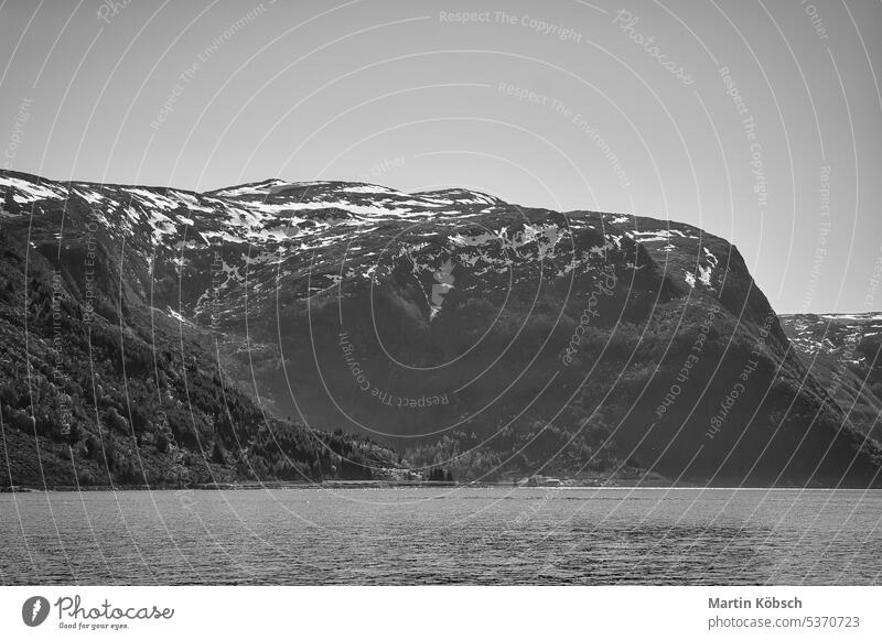 Fjord with view of mountains and fjord landscape in Norway. Landscape shot sunset wilderness nature panorama water nordic sky recreation romantic fresh relax