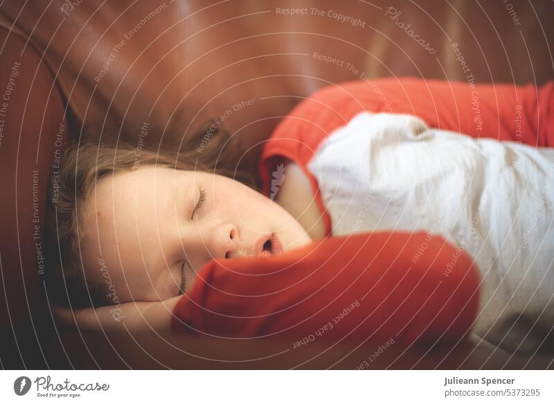 Young child sleeping young girl red and white top girl asleep tired kid Child Sleep Dream Innocent exhausted worn out open mouth