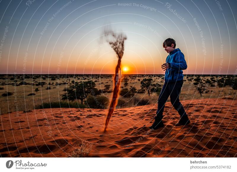 sandstorm Tracks Joy Playing fortunate cheerful balanced Infancy Child Boy (child) Kalahari desert Sky wide Sunlight beautifully Twilight Fantastic Hope Dream