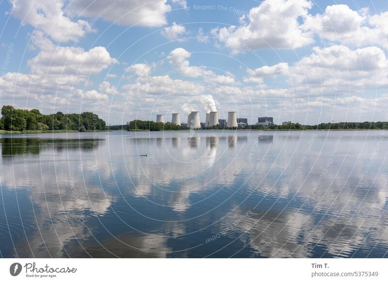 View across the water to the coal power plant Coal power station Sky Reflection Clouds Environment Pond Cooling towers Janschwalde Lausitz forest Summer