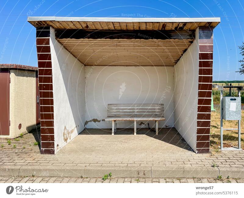 Bus shelter in the countryside Rural rural surrounding Bus stop Passenger shelter Deserted Exterior shot Sky Landscape cloudy sky Idyll idyllically Day