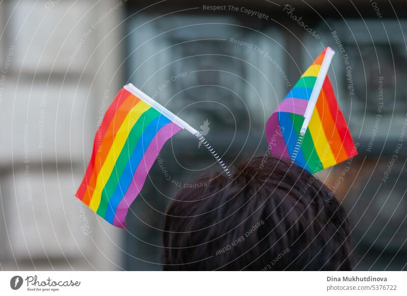 Woman wearing rainbow flags walking at Pride parade. LGBTQ symbol in clothes. rights colorful clothing graphic hat vector cap template background traditional