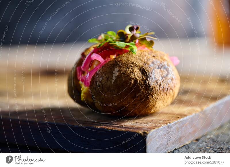 Delicious baked potato with stuffing kumpir chopping board culinary tasty fill herb unpeeled cuisine ecuadorian serve dish food delicious palatable delectable