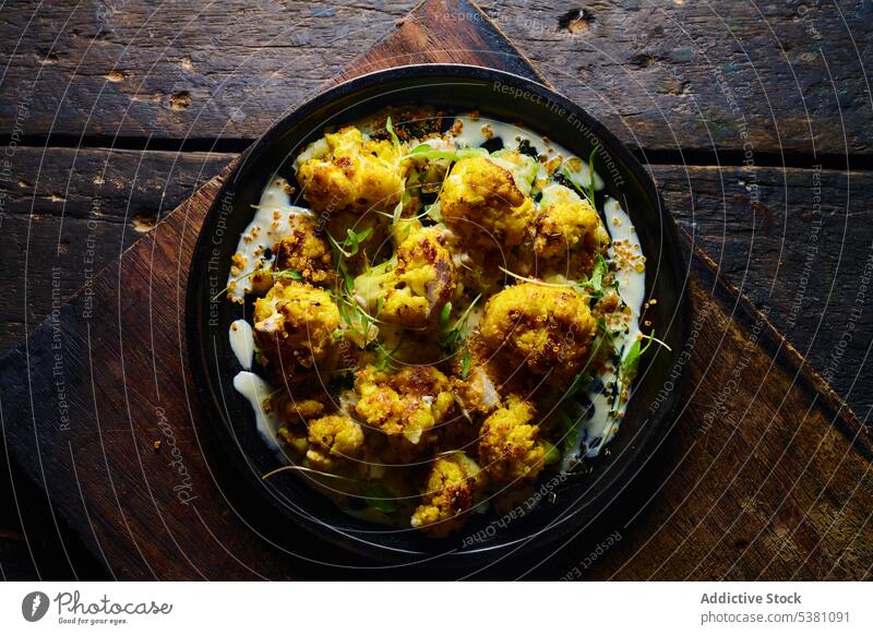 Delicious roasted cauliflower with herbs board vegetable food delicious dish tradition cuisine ecuadorian natural appetizing plate serve delectable kitchen