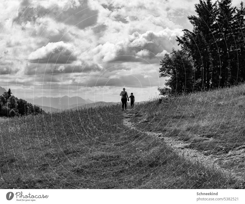 The way of life Mountain Hiking Parents children Growth Nature out Black & white photo Clouds Sun trees Lanes & trails stroll hold hands upbringing Experience