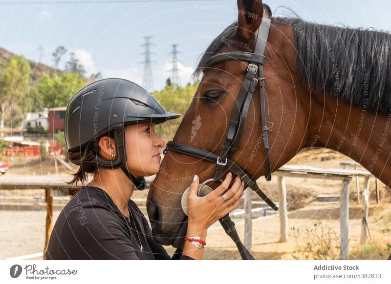 Young woman hugging horse on ranch equestrian countryside animal embrace stable together female farm equine young love stallion horsewoman casual companion