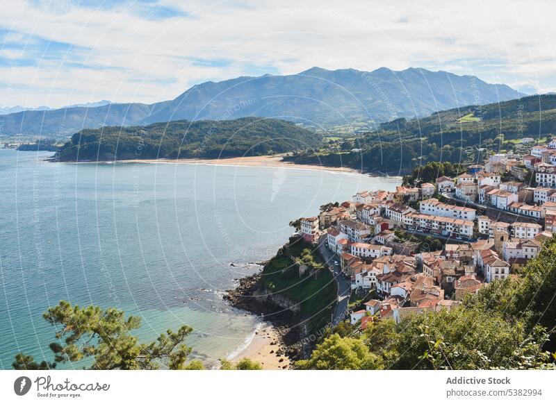 Picturesque view on town and calm sea principality of asturias spain building mountain architecture water shore cityscape landscape nature ridge environment
